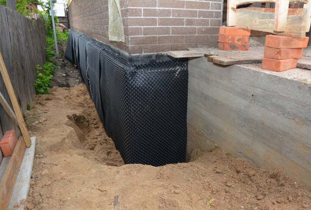 SJ Waterproofing Pros technician performing targeted Wet Basement Repair assessment in North Ridgeville, OH